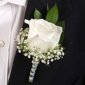 Traditional White Rose - This boutonniere is filled with traditional a white rose. This timeless classic will sure to compliment your attire for your special night. It will go with any other colors.  If would like an upgrade we can add jewels to your boutonniere as well for an additional fee. Please specify the jewel color so we can compliment your tie and vest properly.