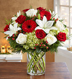 GRAND GRANDEUR CHRISTMAS GRAND GRANDEUR CHRISTMAS - XMAS GREENS LILIES, GERBERS, ROSES, HYDRANGEAS