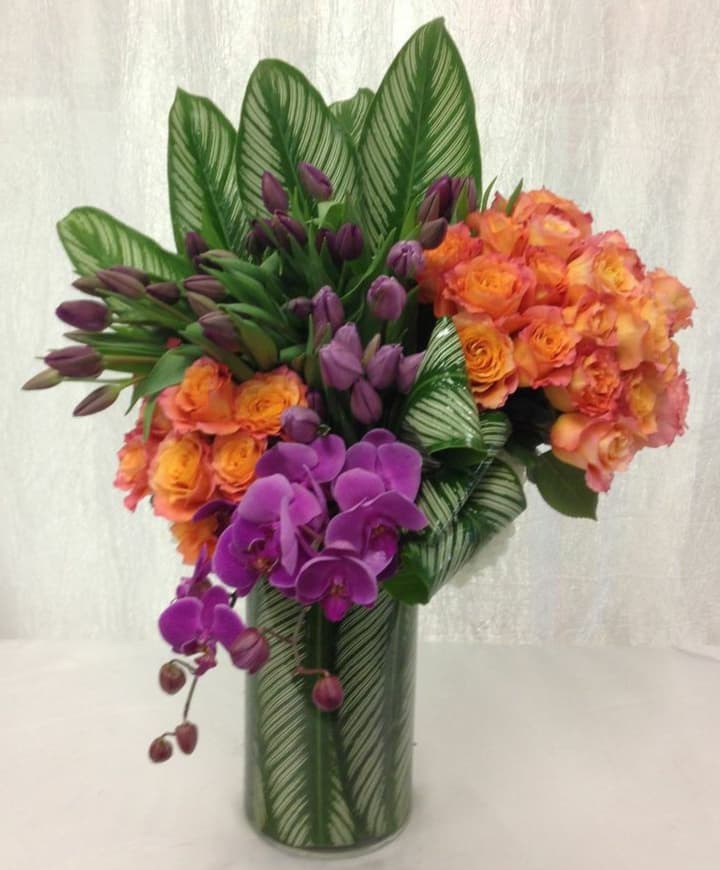 Secondary Perfection - This amazing display of contrasting and vibrant secondary colors orange, green, and purple will be a lush and impressive gift for yourself or loved one.