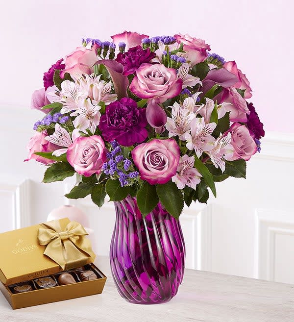 Valentine Splendor Valentine Splendor - A Valentine’s surprise full of splendor and style. Our rich purple and lavender blooms are gathered together into a gorgeous mixed bouquet, for the ultimate declaration of your love on the most romantic day of the year.With box of chocolates. Every upgrade chocolates and flowers increase.