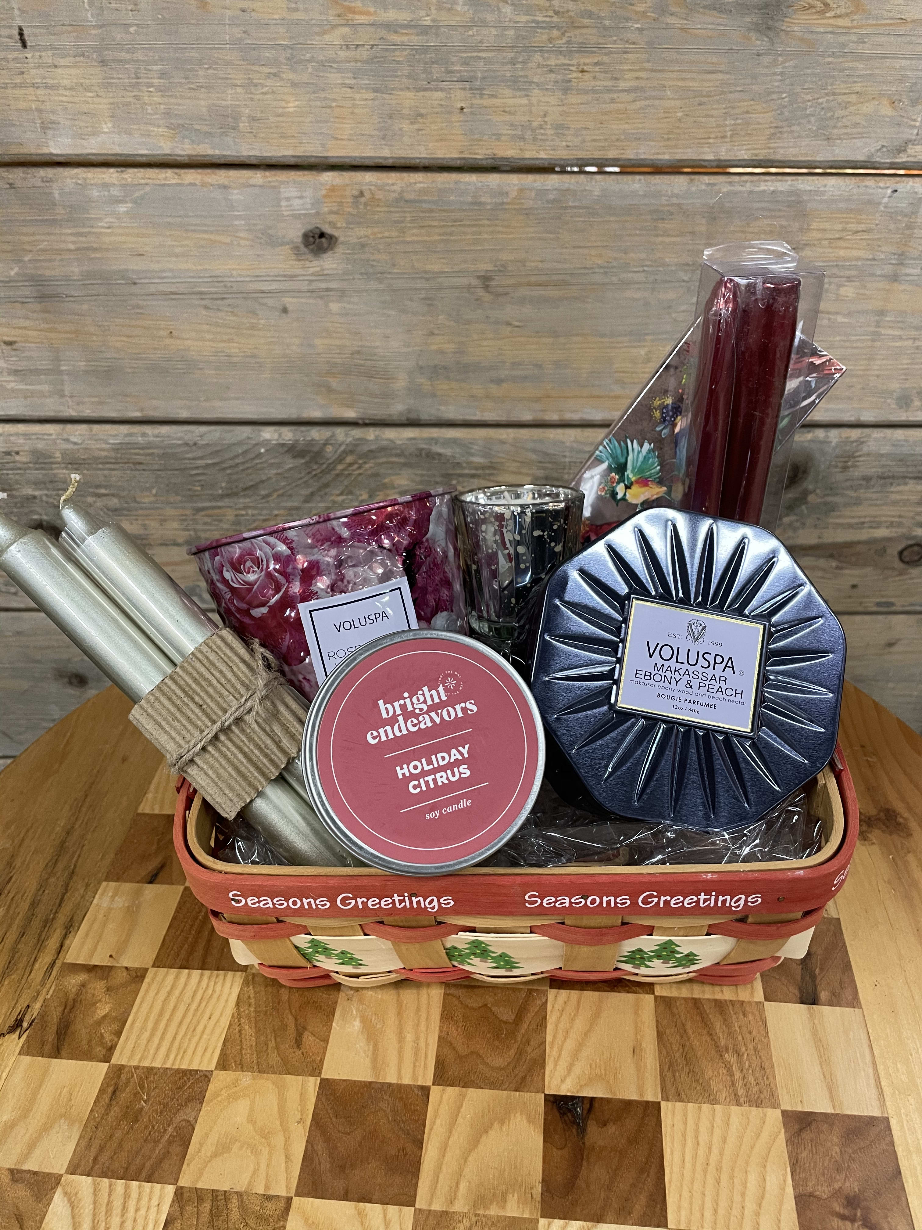 Candle Extravaganza gift basket. - For the friend or family who loves candles. Presented in a basket, wrapped and secured with a lovely ribbon. We have included an interesting selection of candles, each perfect for every occasion.