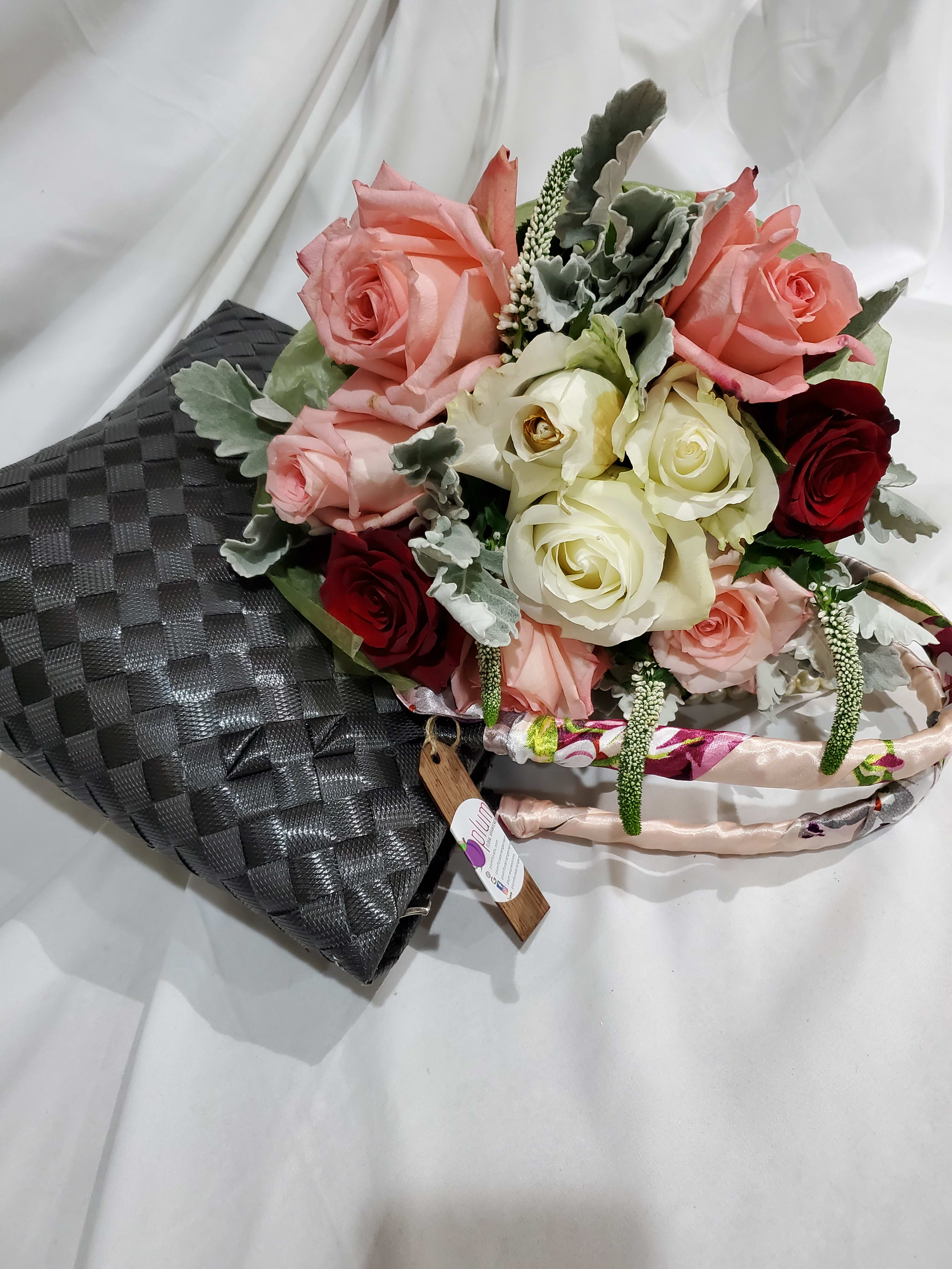 Ciaga II Ciaga II - a bouquet of roses with fillers and a unique hand-woven tote bag form Manila. Limited stock only. ( available color in pink, gray, blue, black, red and green only).