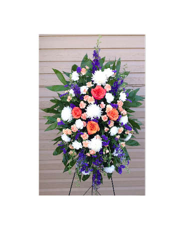 Sincere Condolences Spray - In this hand made spray there is a beautiful mixture of flowers and colors. There is purple Larksburg purple Staus white Carnations white Fugi Mums peach Mini Carnations and peach/orange roses.   FCF-0185