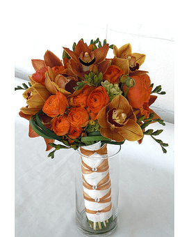 Autumn wedding Autumn wedding - Gorgeous Bridal bouquet in bronze orchids and orange ranunculus.