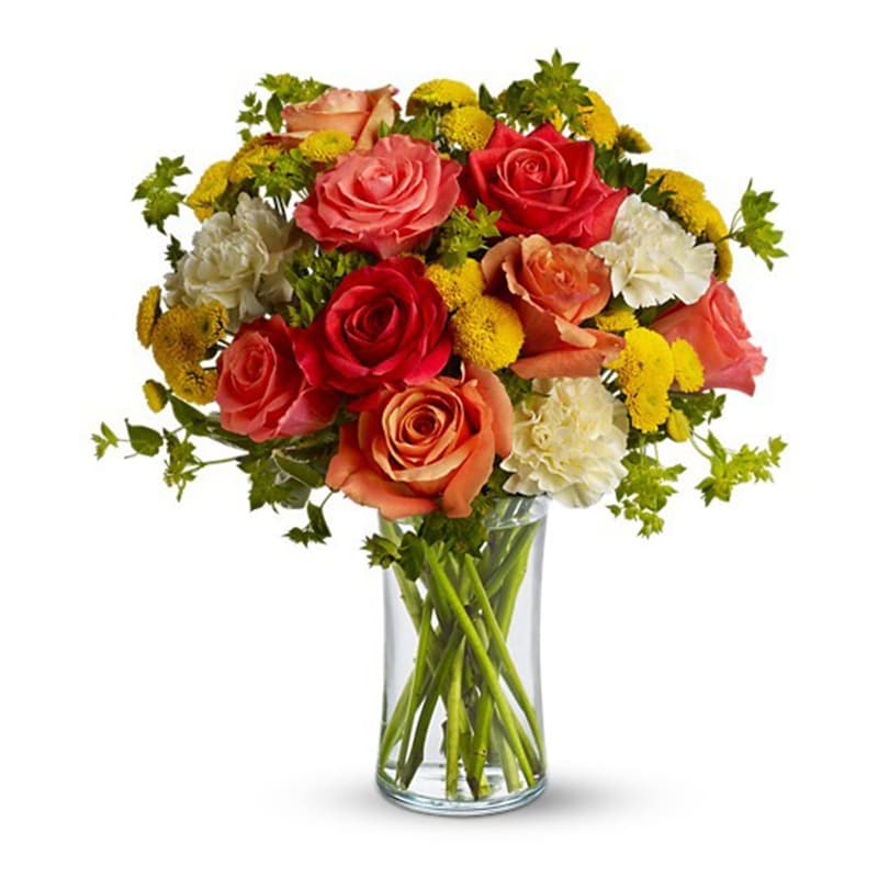 Citrus Kissed Citrus Kissed - Like freshly squeezed lemonade on a hot sunny day, this bright and cheerful bouquet is a summer sensation. Dark orange, coral and orange roses, light yellow carnations, yellow button spray chrysanthemums and greens fill a slender gathering vase. It's a kiss of summer! Product ID: T157-1A