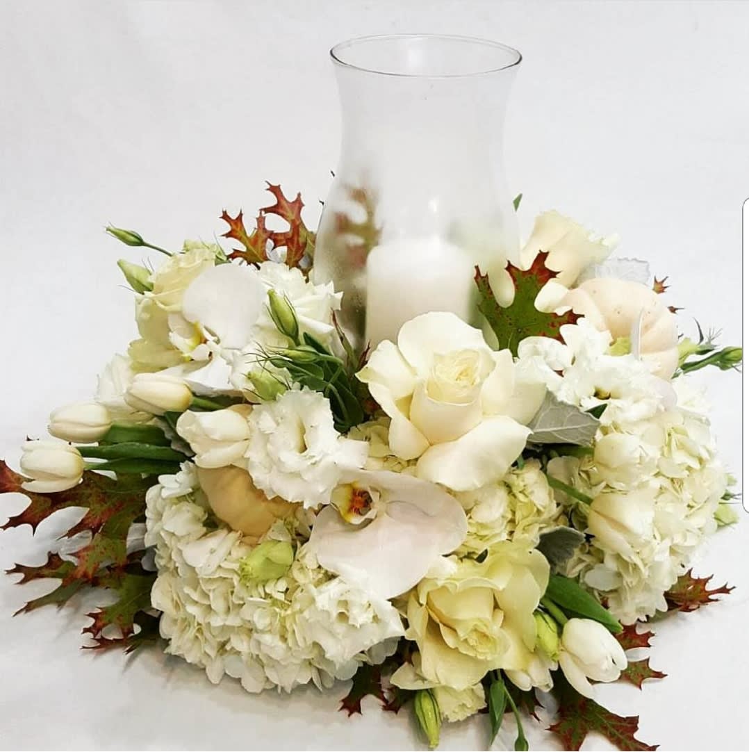 Dance with Roses - A seasonal sensation. Wow them this winter with a show-stopping centerpiece of roses and lilies makes a magnificent centerpiece for the holidays . This is one gift that's guaranteed to shine.