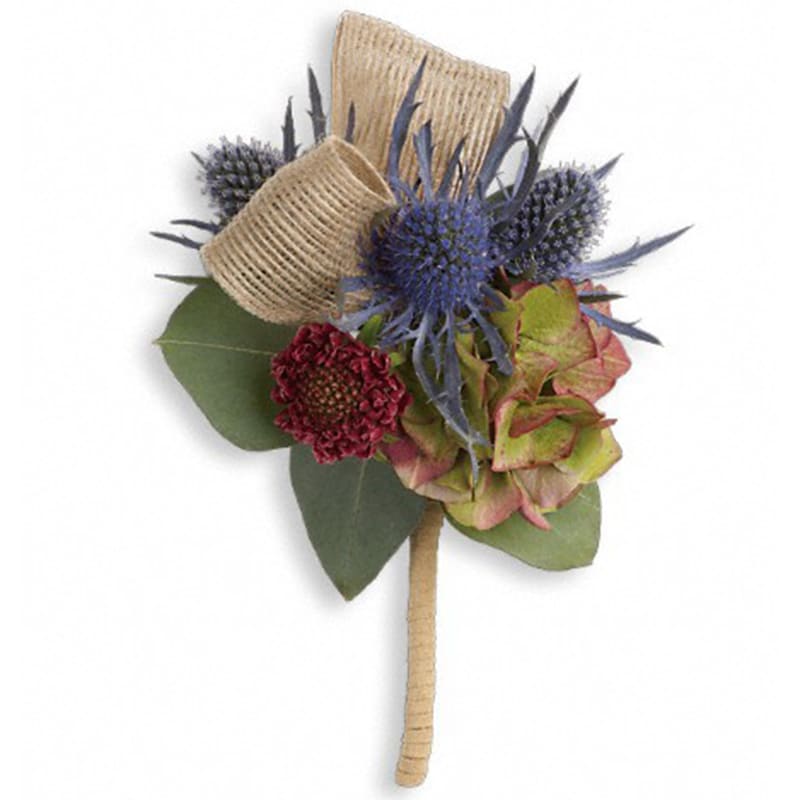  Midnight Wanderings Boutonniere - Stand out from the crowd with this wild, stylish mix of green hydrangea and blue eryngium.  Green hydrangea, burgundy scabiosa and blue eryngium. Approximately 3&quot; W x 5&quot; H  Product ID: TPR01-1A