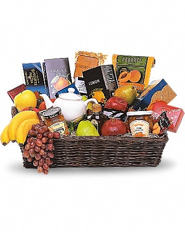  Grande Gourmet Fruit Basket - When you want to send your thoughts in a grande way, send this basket filled with fresh fruit, biscuits and tea. Nothing's grander.  Fresh fruits, biscuits, chocolates and teas, along with a charming teapot, arrive in an impressive wicker tray.  Approximately 21 1/2&quot; W x 13&quot; H Please note: All of our bouquets and gift baskets are hand-arranged and delivered locally by professional florists. This item may require additional lead time so same-day delivery is not available.   Product ID: T213-1A