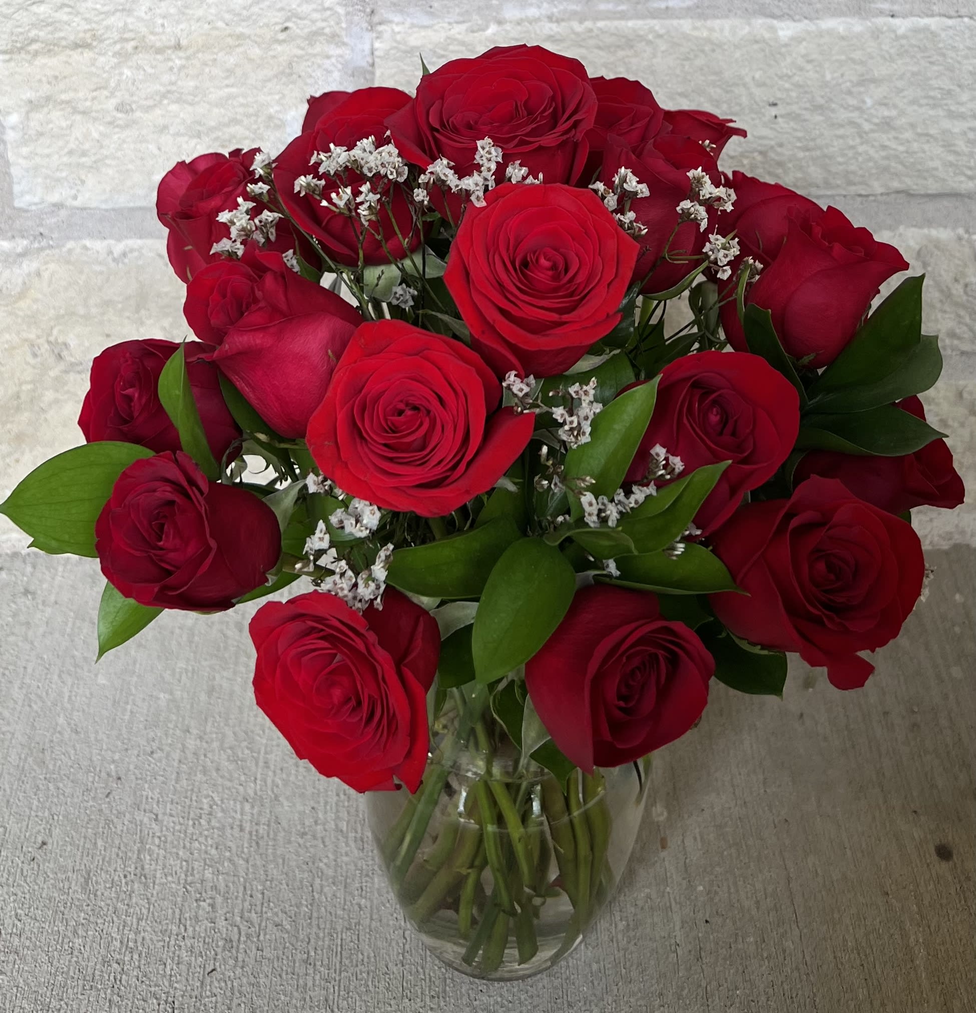 48 stems red rose wrap with color paper in Sharpstown, TX - TOP FLORIST