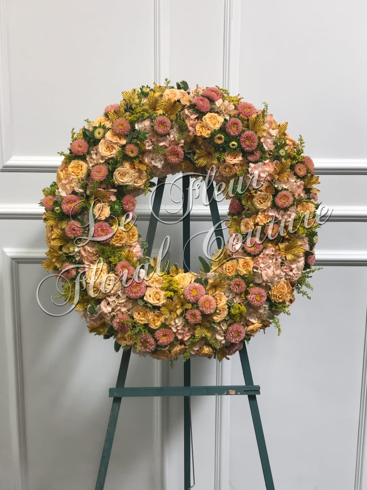 Perfect Peach Wreath - A beautiful wreath consisting of peach hydrangea, peach asters, yellow astromeria, yellow spray roses and accented with solidago.