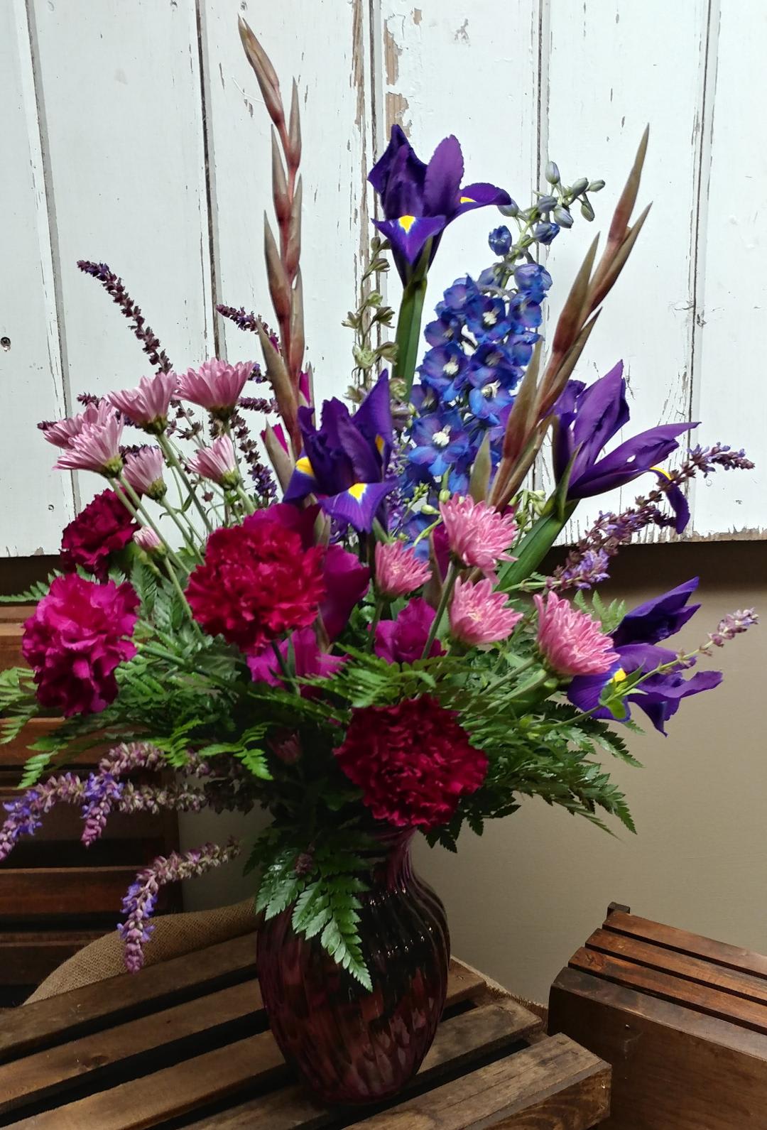 Garden Joy Bouquet, Custom Design by Cold Spring Floral Garden Joy Bouquet, Custom Design by Cold Spring Floral - Send Bright Summer Fun to Someone Special with this Generous Mixed arrangement of Garden-style flowers; Purple Iris, Fuchsia Gladiolas, Purple Carnations, Lavender Daisy Mums, Salvia, Delphinium and mixed greenery. Flowers are subject to substations based upon availability and may vary.