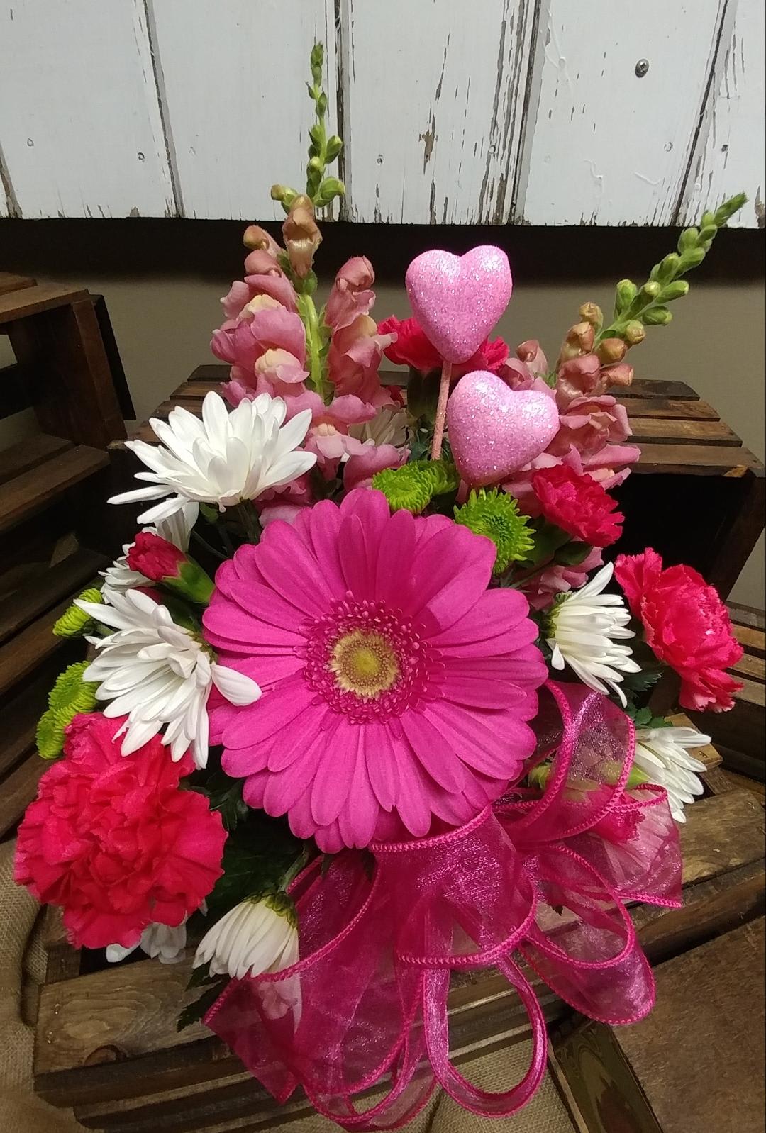 Sweetheart Bouquet. Custom Design by Cold Spring Floral - Pink Gerbera Daisy, Pink Carnations, White Daisies, Green Kermit Button Mums and Pink Snap- Dragons and mixed greenery in a Pink Metal Container.