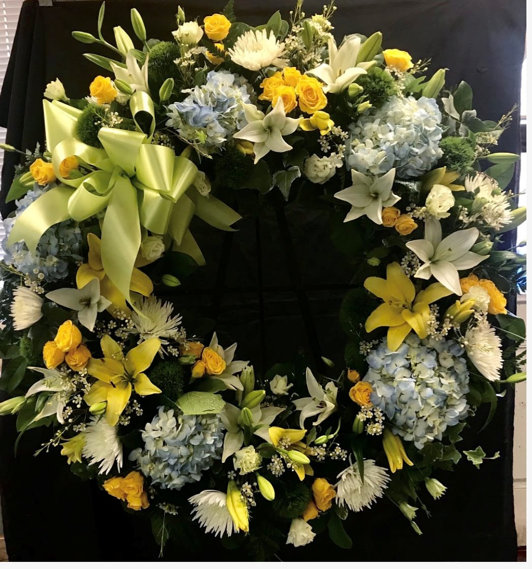 Cheerful Grace Wreath - A beautiful wreath with light colors incorporated together to create an elegant style wreath