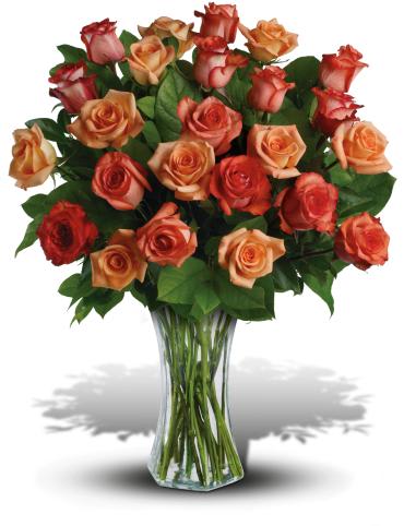 Sunrise Splendor - It will be warm day in Love Land when you surprise your lady with this ravishing array of orange, light orange and dark orange roses in a sparkling flared vase. Twenty-four fabulous, flaming roses in all - she'll definitely feel the heat.  This dazzling bouquet includes orange roses, light orange roses and dark orange roses accented with salal. 