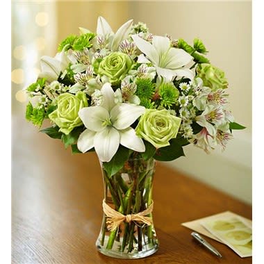 Serene Green Serene Green - This arrangement is made up of lime green and white, using carnations, roses, lillies and filler