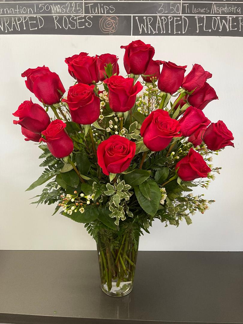 2dz roses - 24 red roses, in a glass vase with greens and filler,  30 delux, 36 premium.