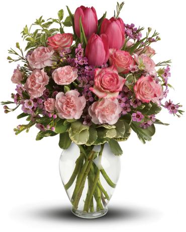 Full Of Love Bouquet - It's beauty-full! Bursting with tantalizing tulips and radiant roses, this delightful pink arrangement brings spring joy to that special someone.  Includes pink roses, tulips, carnations and waxflower, accented with fresh pitta negra and variegated pittosporum. 