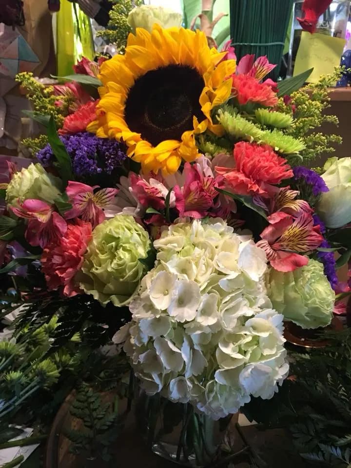 Jubilation! - A Kaleidoscope of color with all these fresh blooms will surely brighten the day ! Great for Birthday's, Get Well or Just Because - Hand arranged in one of our many containers.