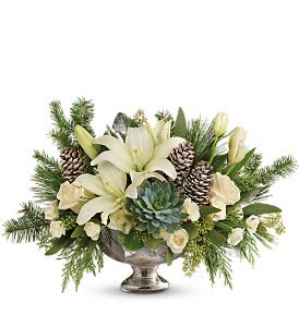 Winter Wilds Centerpiece [TWR14-3A] - Fresh winter greens and snow-white blooms are paired to perfection in this unique centerpiece, presented in a mercury glass bowl.  This beautiful arrangement of crème roses, white spray roses, white tulips, and white asiatic lilies is accented with seeded eucalyptus, lemon leaf, flat cedar, douglas fir, white pine, and a large green echeveria succulent. Delivered in a mercury glass bowl.  Approximately 19 1/2&quot; W x 12 1/2&quot; H  Orientation: All-Around      As Shown : TWR14-3A