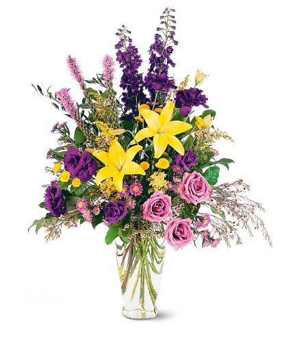 TF204-2 Loving Beauty Bouquet TF204-2 Loving Beauty Bouquet - With its gorgeous yellow and purple flowers, this beautiful arrangement is a reminder that love is everlasting. One arrangement arrives decorated with yellow lilies and purple liatris, asters and roses, in a classic clear glass vase. Approximately 29" W x 38" H