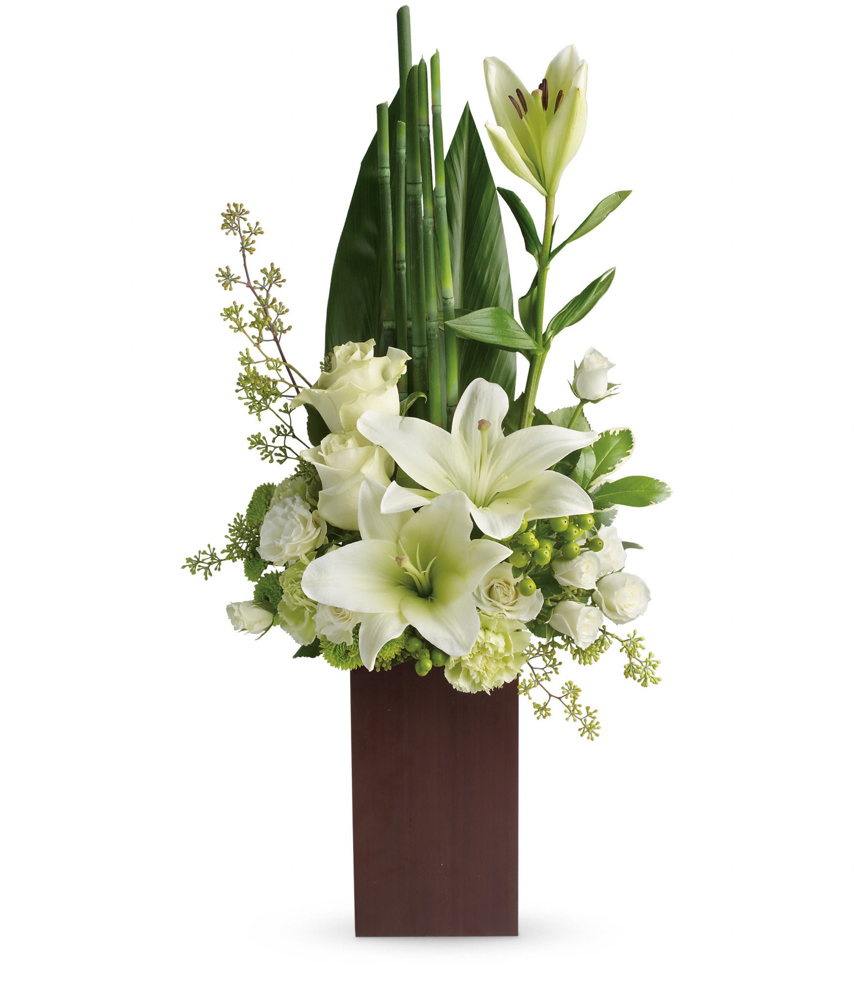 Teleflora's Peace And Harmony Bouquet - Send zen. Pure white blooms and fresh tropical greens combine to stunning effect in this stylish arrangement. Presented in a contemporary bamboo vase they'll enjoy for years to come. 