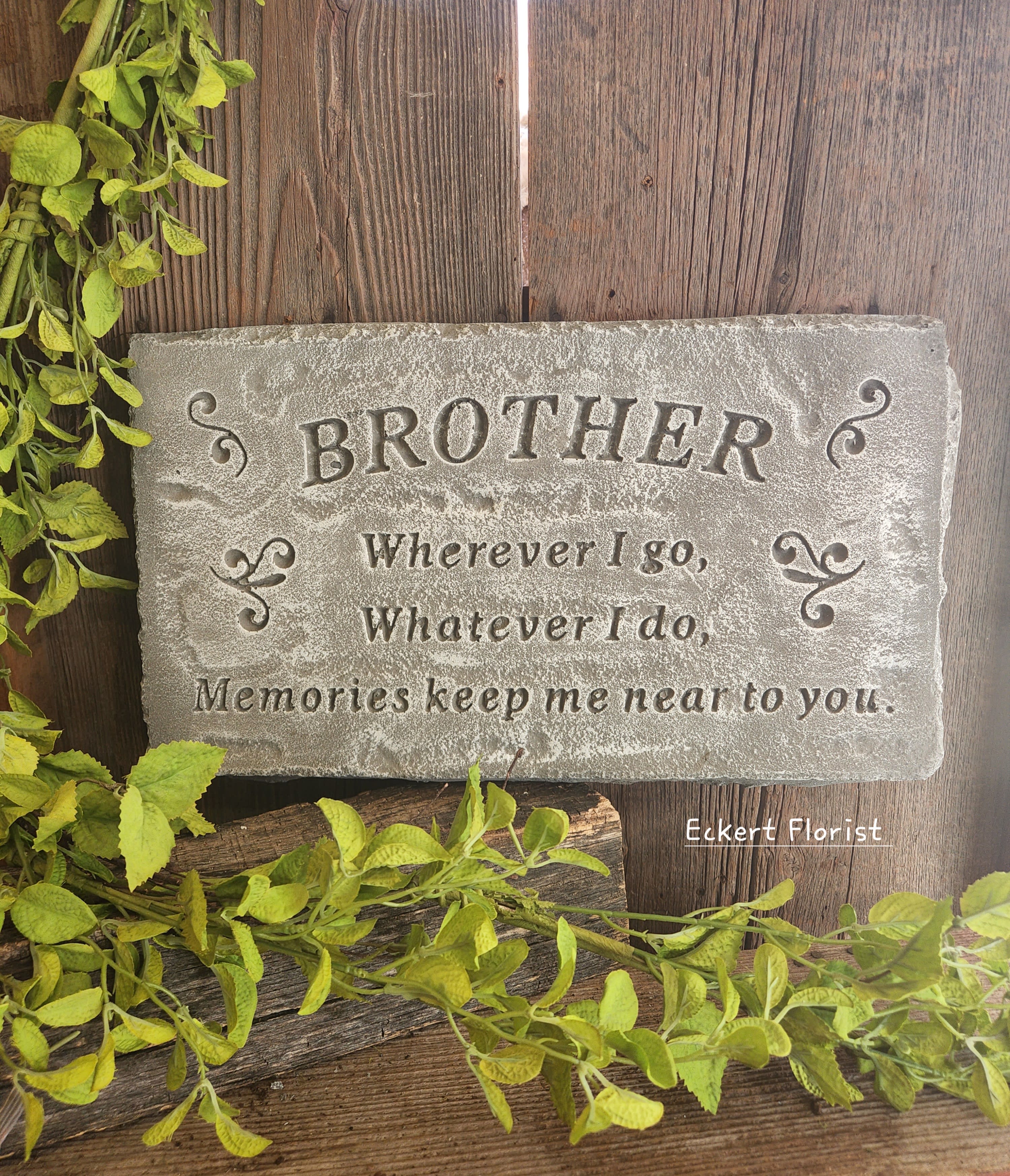 Eckert Florist's &quot;Brother...&quot; Memorial Stone - *Our Local Delivery Only &quot;Brother - Wherever I go, Whatever I do, Memories keep me near to you.&quot; Cement Stone measures approx. 10&quot; H X 17.5&quot; W *Stand Included *Upgrade with artificial flowers. See Deluxe option. ALL OF OUR STONES COME DECORATED WITH A SHEER BOW, WILLOW, RAFFIA, AND OUR SIGNATURE BIRD.