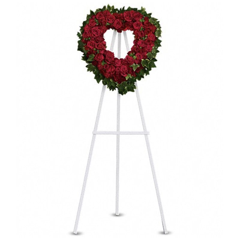 Blessed Heart [T225-2A] - A beautiful heart is a wonderful way to share your thoughts of love.  Red roses, spray roses, carnations and miniature carnations are arranged with fern and ivy in the shape of a heart.  Approximately 23&quot; W x 24&quot; H  Orientation: One-Sided  As Shown : T225-2A