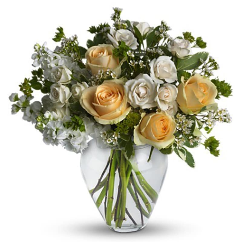 Celestial Love [T209-2A] - Peaceful and pure. This pretty arrangement of white and light colors will let anyone know they are in your thoughts.  Fresh flowers such as peach roses, crème spray roses, white stock, waxflower and more are gathered in a beautiful clear vase.  Approximately 16&quot; W x 16&quot; H  Orientation: One-Sided      As Shown : T209-2A