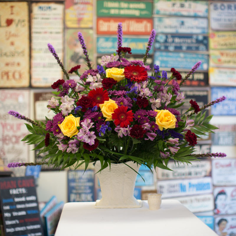 Large sympathy tributeFG402 - Honor and recognize the one who is gone.  Each basket is customized for your loved one.  Beautiful &quot;Jewel&quot; toned flowers are shown here.  Approximately 38&quot; H and 44&quot; W.  