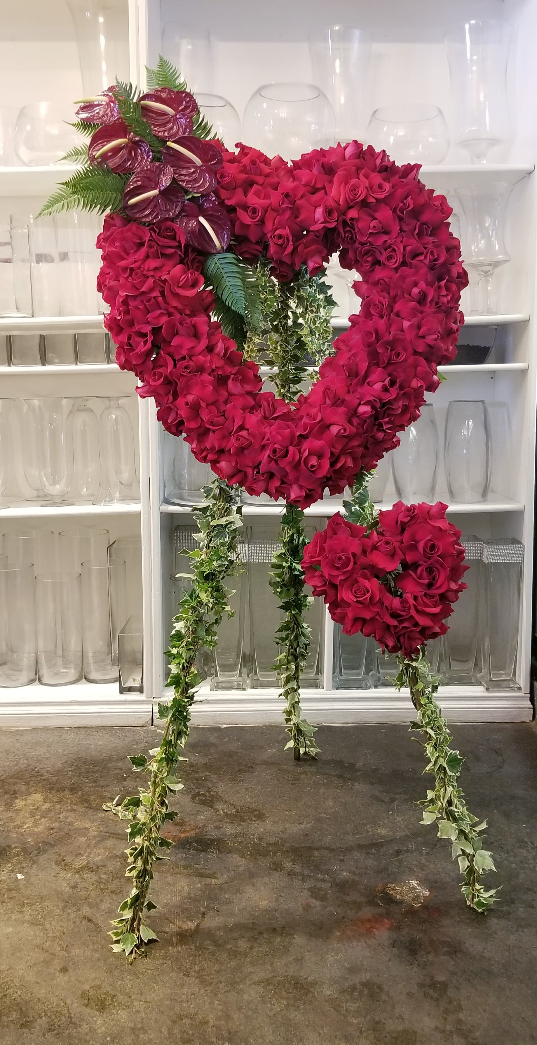 Heart - Open heart wreath of red roses with smaller red heart.
