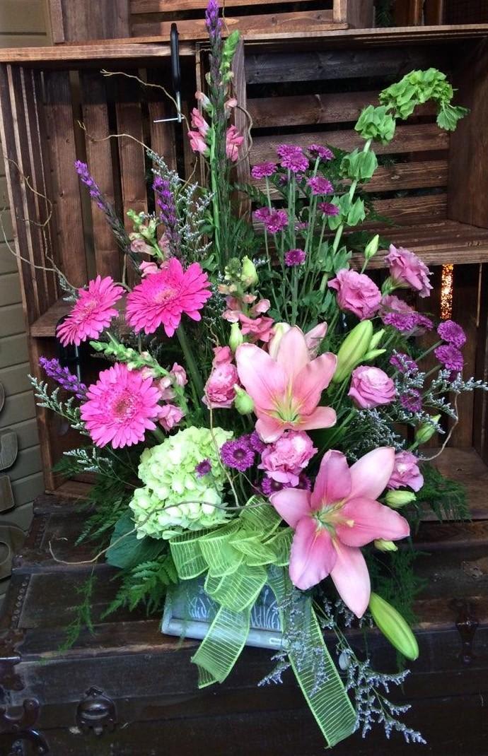 Eternal Garden Bouquet. Custom Design by Cold Spring Floral Eternal Garden Bouquet. Custom Design by Cold Spring Floral - Pink Asiatic Lilies, Pink Gerbera Daisies, Purple Liatris, Pink Snapdragons, Purple Mums, Green Hydrangea, Lavender Lisianthus, Green Bells of Ireland and Mixed Garden Greens.