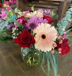 Delicate Bouquet  - This pristine bouquet is filled with roses, carnations, daisies, mums and other in season flowers. 