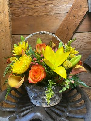 Golden Meadow  - This wonderous arrangement includes, roses, lilies, mums and other bright flowers to match the season. 