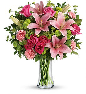  Dressed To Impress Bouquet [TEV42-4A] - Gorgeously girly! Like sending a party in a vase, this breathtaking bouquet of blushing roses and lilies is a positively pink-tastic way to celebrate someone special.  This fabulously feminine bouquet features hot pink roses, hot pink spray roses, pink asiatic lilies, pink carnations, green button spray chrysanthemums, bupleurum, huckleberry and lemon leaf. Delivered in a clear glass vase.  Approximately 17 1/2&quot; W x 20&quot; H  Orientation: One-Sided      As Shown : TEV42-4A