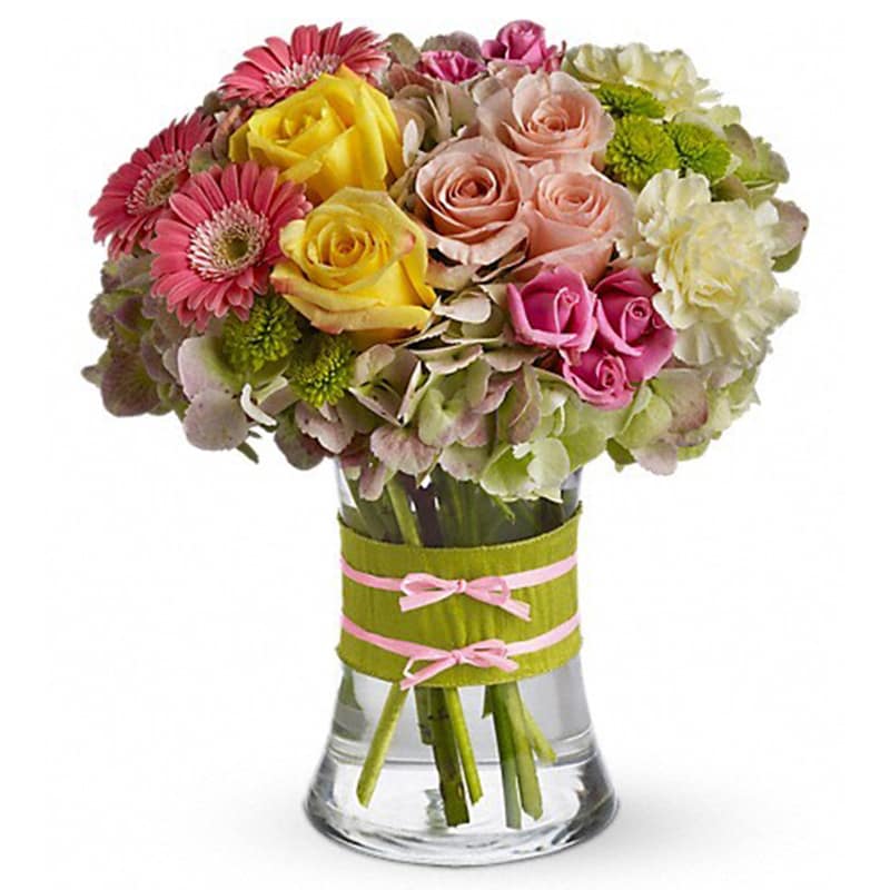  Fashionista Blooms [T155-1A] - This arrangement would be perfect for any girl with an eye for style. It's a must-have for fashionistas everywhere.  Gorgeous green hydrangea, yellow and light pink roses, pink spray roses and mini gerberas, light yellow carnations and green button spray chrysanthemums are delivered in a pretty gathering vase. Not just any vase, of course, this one's accessorized with a chartreuse taffeta ribbon and pink raffia.  Approximately 10&quot; W x 11&quot; H  Orientation: All-Around      As Shown : T155-1A