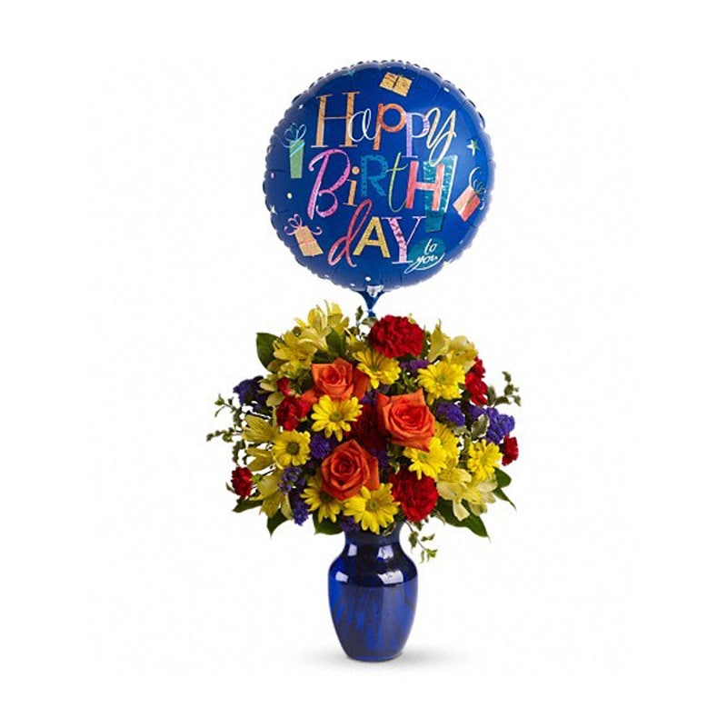 Fly Away Birthday Bouquet [T24-1A] - Make birthday spirits soar by sending this fabulously fun birthday bouquet and balloon. Bright primary colors make it perfect for guys and gals. Years may fly by but that doesn't mean birthday celebrations need to!  Brilliant orange roses, yellow alstroemeria, red carnations and miniature carnations, yellow daisy spray chrysanthemums, purple statice and a big bright balloon are all delivered in a beautiful cobalt blue vase. It's a thumbs-way-up choice in birthday gifts!  Approximately 16 3/4&quot; W x 19 1/4&quot; H  Orientation: All-Around      As Shown : T24-1A