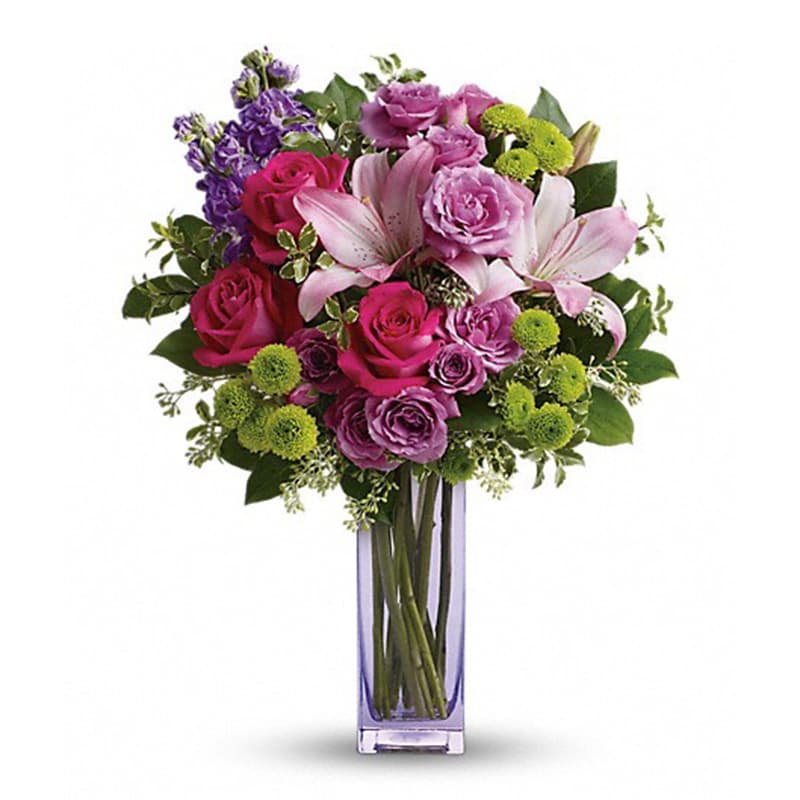 Fresh Flourish Bouquet [TEV40-2A] - Color them happy with this bold, beautiful mix of hot pinks, flirty lavenders, and lime greens! Hand-delivered in a lavender glass vase, this posh present pampers your loved one on a special day - or any day at all!  This luxe bouquet includes hot pink roses, lavender spray roses, pink asiatic lilies, lavender stock, green button spray chrysanthemums, pitta negra, seeded eucalyptus and lemon leaf. Delivered in a tall glass vase.  Approximately 15 1/2&quot; W x 19 3/4&quot; H  Orientation: One-Sided      As Shown : TEV40-2A