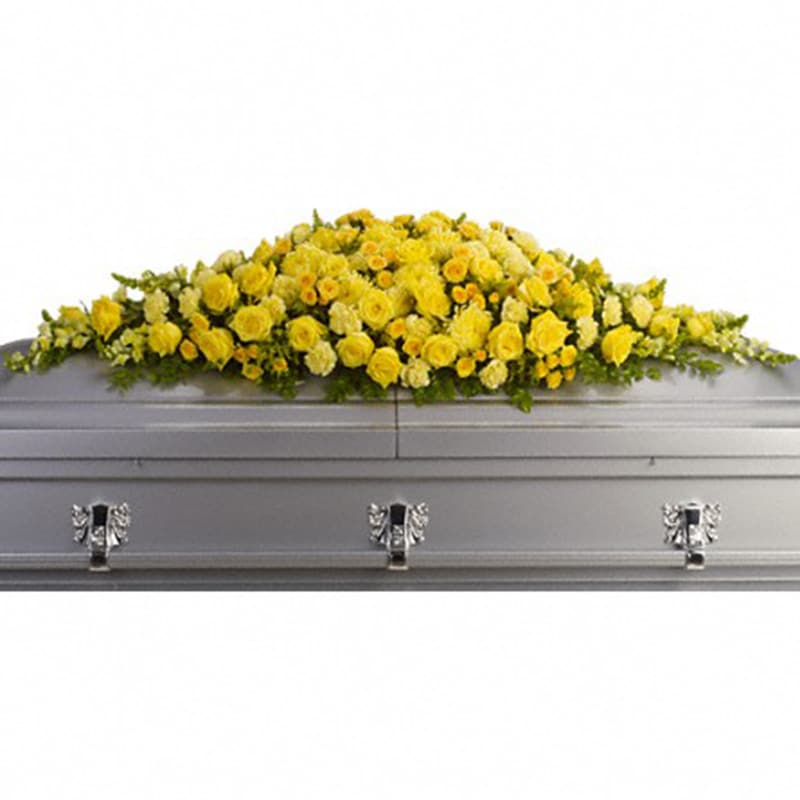 Golden Garden Casket Spray [T243-1A] - In our darkest hours, a radiant display of sunshine is sure to warm hearts, especially when the sunshine is delivered in such a beautiful way. This spray offers an abundance of brilliant yellow blossoms.  Sunny yellow roses, spray roses, carnations, chrysanthemums, snapdragons and more are arranged in a dazzling full casket spray.  Approximately 64&quot; W x 16&quot; H  Orientation: N/A  As Shown : T243-1A