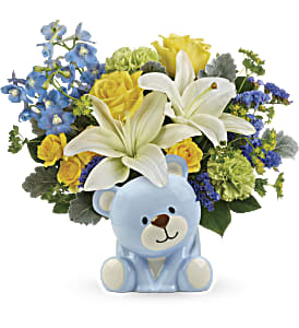 Sunny Cheer Bear Bouquet Sunny Cheer Bear Bouquet - Spread cheer far and near with this sunny bouquet of yellow roses and white lilies, charmingly arranged in this sweet ceramic teddy bear keepsake.