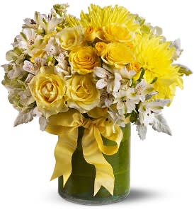 Lemon Aid [TFWEB319] - If life is giving someone lemons, send them a Lemon Aid! This bright and cheerful medley of sunny yellow and white blossoms is a wonderful &quot;get well soon&quot; bouquet, and the perfect gift for someone who's feeling down. A leaf-lined vase and cheerful yellow ribbon add an extra touch of color.  An assortment of fresh flowers such as roses, dahlias and stock, in shades of yellow, white and green, is arranged in a clear glass cylinder vase that’s lined with leaves and decorated with a yellow ribbon.  Approximately 13&quot; (W) x 14&quot; (H)  Orientation: All-Around      As Shown : TFWEB319  