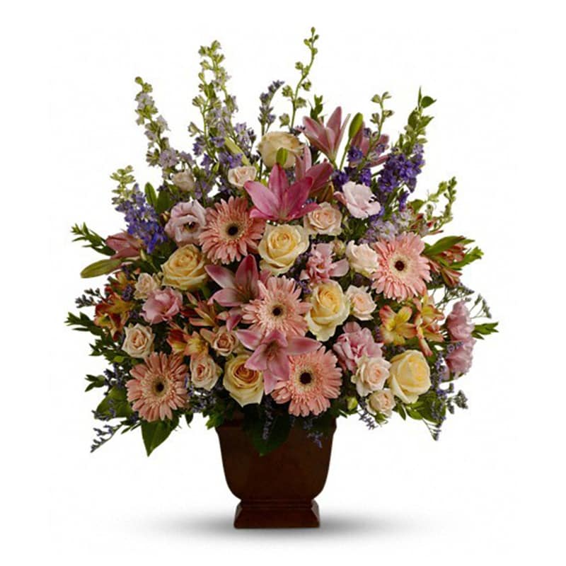Loving Grace [T220-1A] - A warm and peaceful bounty of pastel blossoms gently expresses love and respect. A gracefully composed arrangement appropriate for home or service.  Fresh flowers such as peach and light pink roses, lavender and purple larkspur, pink asiatic lilies, alstroemeria, gerberas and lisianthus are set in an exclusive Noble Heritage urn.  Approximately 26&quot; W x 30&quot; H  Orientation: One-Sided      As Shown : T220-1A  
