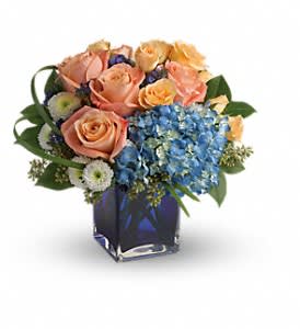 Modern Blush Bouquet [T600-4A] - Send these fashionable flowers on any occasion that calls for high style! Lush and luxurious, this chic mix of hydrangea and roses is hand-delivered in a bold blue glass cube vase for a gorgeous gift they won't forget.  This chic bouquet includes blue hydrangea, peach roses, peach spray roses, white matsumoto asters, blue sinuata statice, seeded eucalyptus, lily grass and lemon leaf. Delivered in a blue cube vase.  Approximately 12 1/2&quot; W x 11 1/2&quot; H  Orientation: All-Around      As Shown : T600-4A 