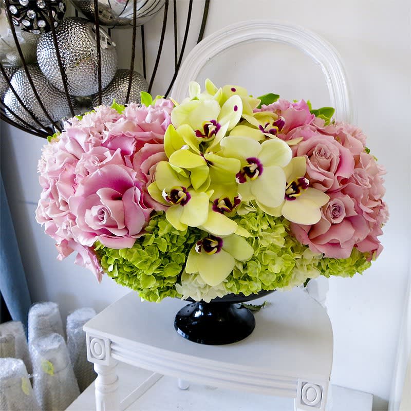 Everyday Glam - Perfectly pink Roses and elegant phalaenopsis orchids come together with green hydrangea in this lavish arrangement perfect for any spring occasion.