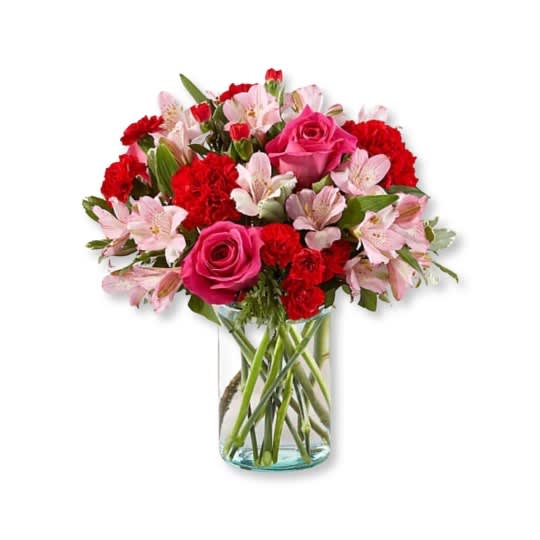 Precious Heart - Handcrafted and inspired by the gorgeous hues of the season, this bouquet is full of sweet sentiment for your favorite person. Hot pink roses, red carnations, pink alstroemeria, and pale pink carnations come together in a clear glass vase to make any room feel beautiful and light. From special birthdays to simply just because, this arrangement is a stunning gift to give your loved ones for every occasion.