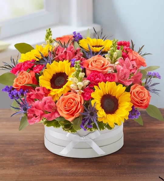 Beautiful Blooms™ Bouquet Beautiful Blooms™ Bouquet - An exquisite gift with beautifully bespoke style. Our vibrant gathering of blooms is arranged in our signature European hatbox: an elegant, new dove gray container finished with a matching ribbon. Its versatile design is perfect for displaying a variety of colors, adding to the custom feeling of this special keepsake.