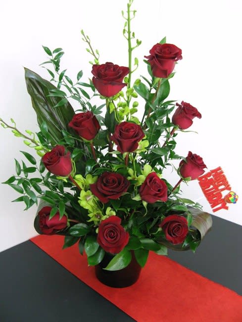 perfect smile of love - roses and orchids elaborated on a special ceramics base for anniversaries and birthdays