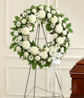 Sympathy tribute all white wreath  - Sympathy tribute all white wreath based on the flowers description white mums, white carnations and white daisies.