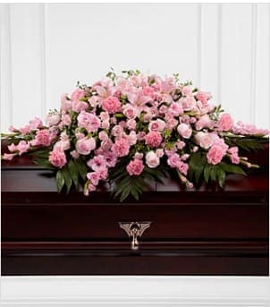 The Sweetly Rest Casket Spray The Sweetly Rest Casket Spray - The Sweetly Rest Casket Spray is a wonderful way to commemorate a life abundant in beauty and love. Blushing pink roses, spray roses, carnations, gladiolus, mini carnations and Asiatic lilies are elegantly arranged amongst an assortment of lush greens to create a sophisticated display meant to bedeck the top of their casket at the final memorial service. Approximately 48"W x 38"D. Your purchase includes a complimentary personalized gift message.