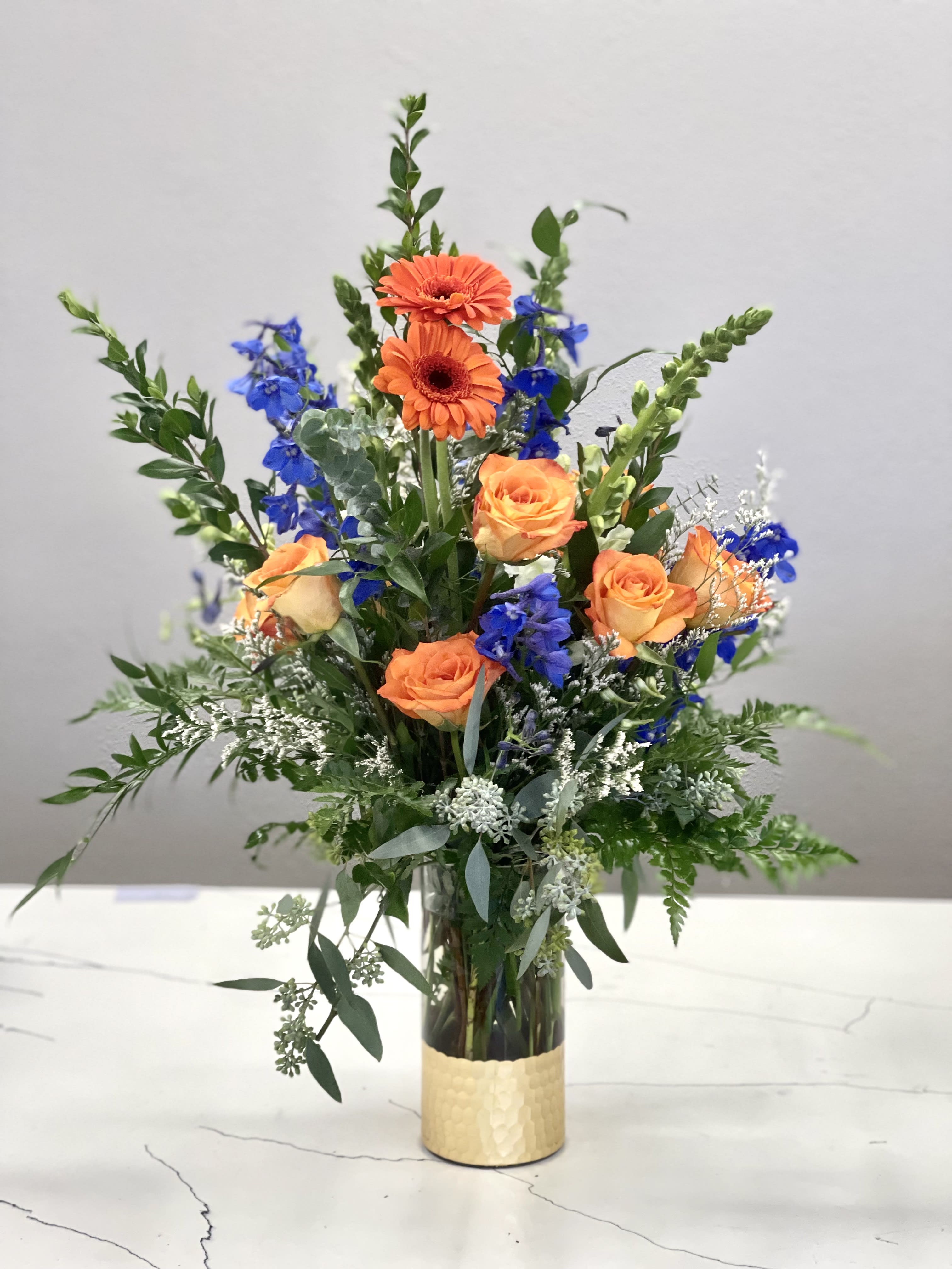 A new day - Flowers to put a smile on their face. Let them know that you are thinking of therewith this tall collection of roses and foliage.