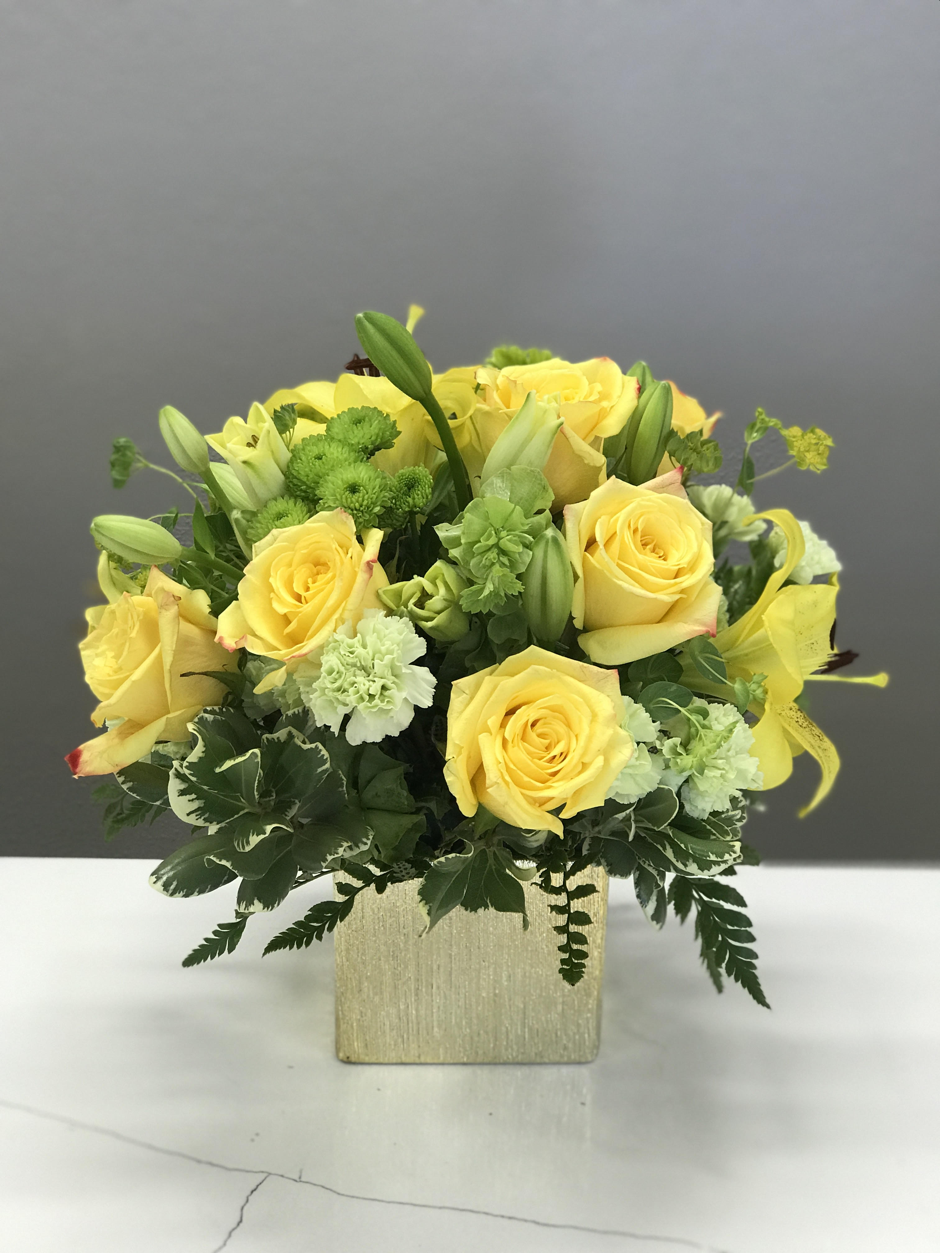 Chartreuse Charisma  - Green and yellow dancing together to brighten the day of friends or family in this elegant and light-hearted arrangement. 